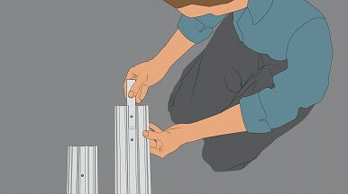 A drawing showing a man preparing to install a 15mm commercial door threshold seal