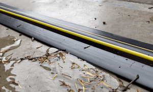 Clean 20mm garage door floor seal after heavy rainfall